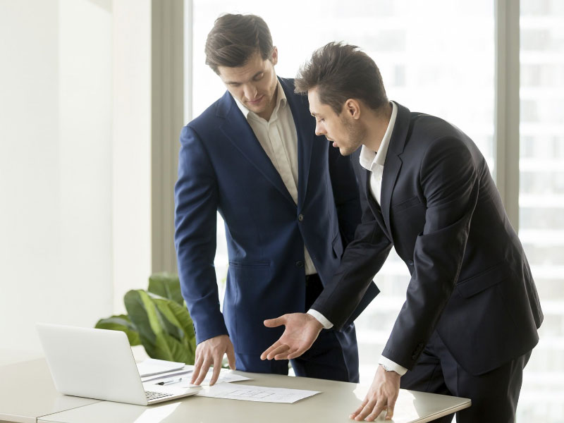 Solicitors discussing evidence for asbestos compensation claim
