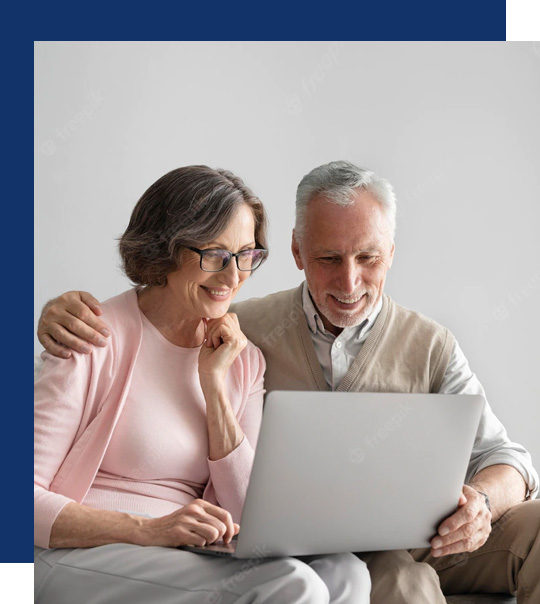Older couple reviewing asbestos compensation claim online